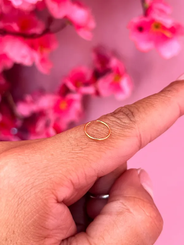Piercing de argola em aço dourado
