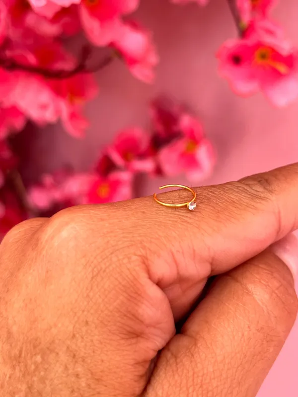 Piercing de argola em aço dourado c/ponto de Luz para o nariz  