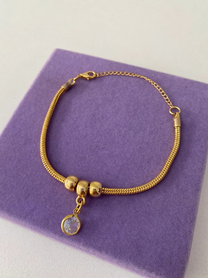 PULSEIRA COM PONTO DE LUZ FOLHEADO A OURO  - 1