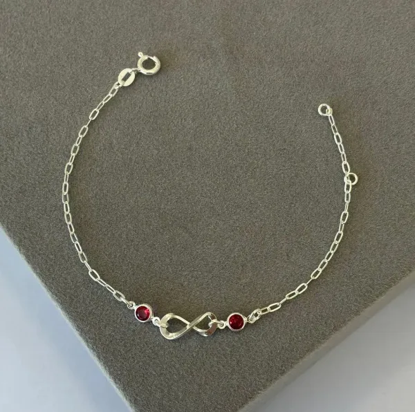 Pulseira infinito e pontos rosa fucsia